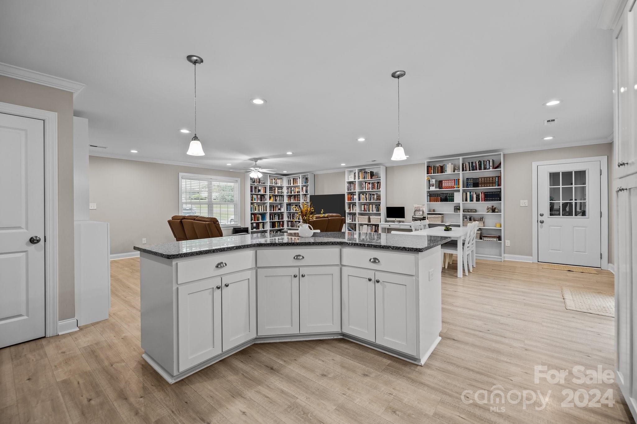 378 Boyd Faile Road Heath Springs, SC 29058 - Photo 12 of 28 a kitchen with stainless steel appliances granite countertop a stove top oven a sink and a refrigerator