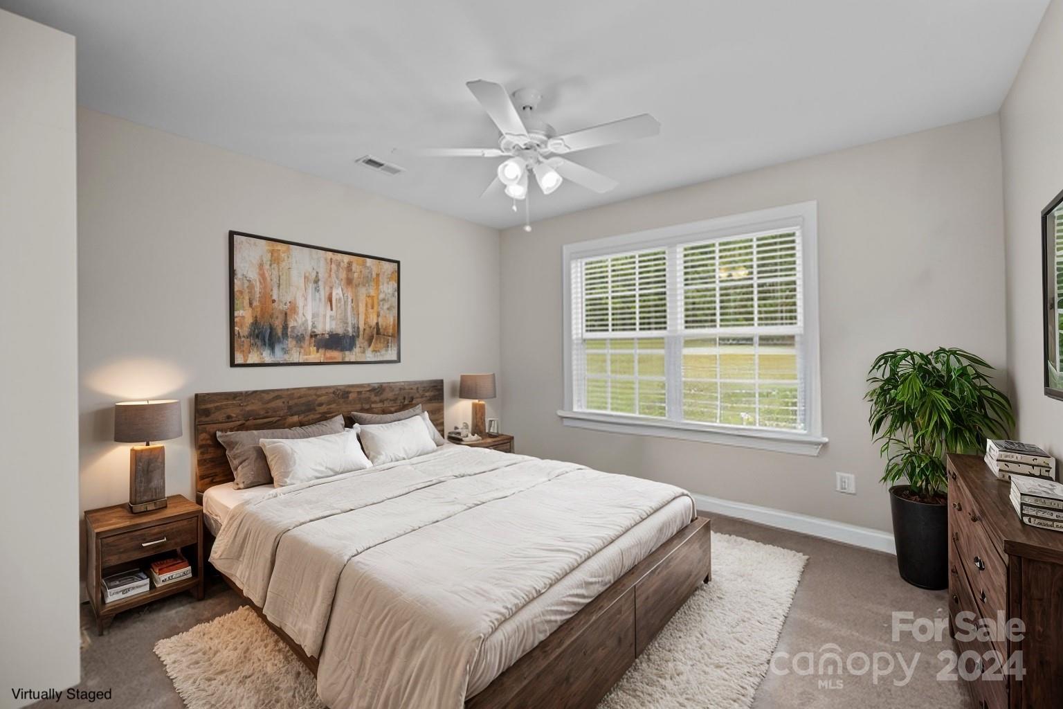 378 Boyd Faile Road Heath Springs, SC 29058 - Photo 16 of 28 a bedroom with a bed and a large window