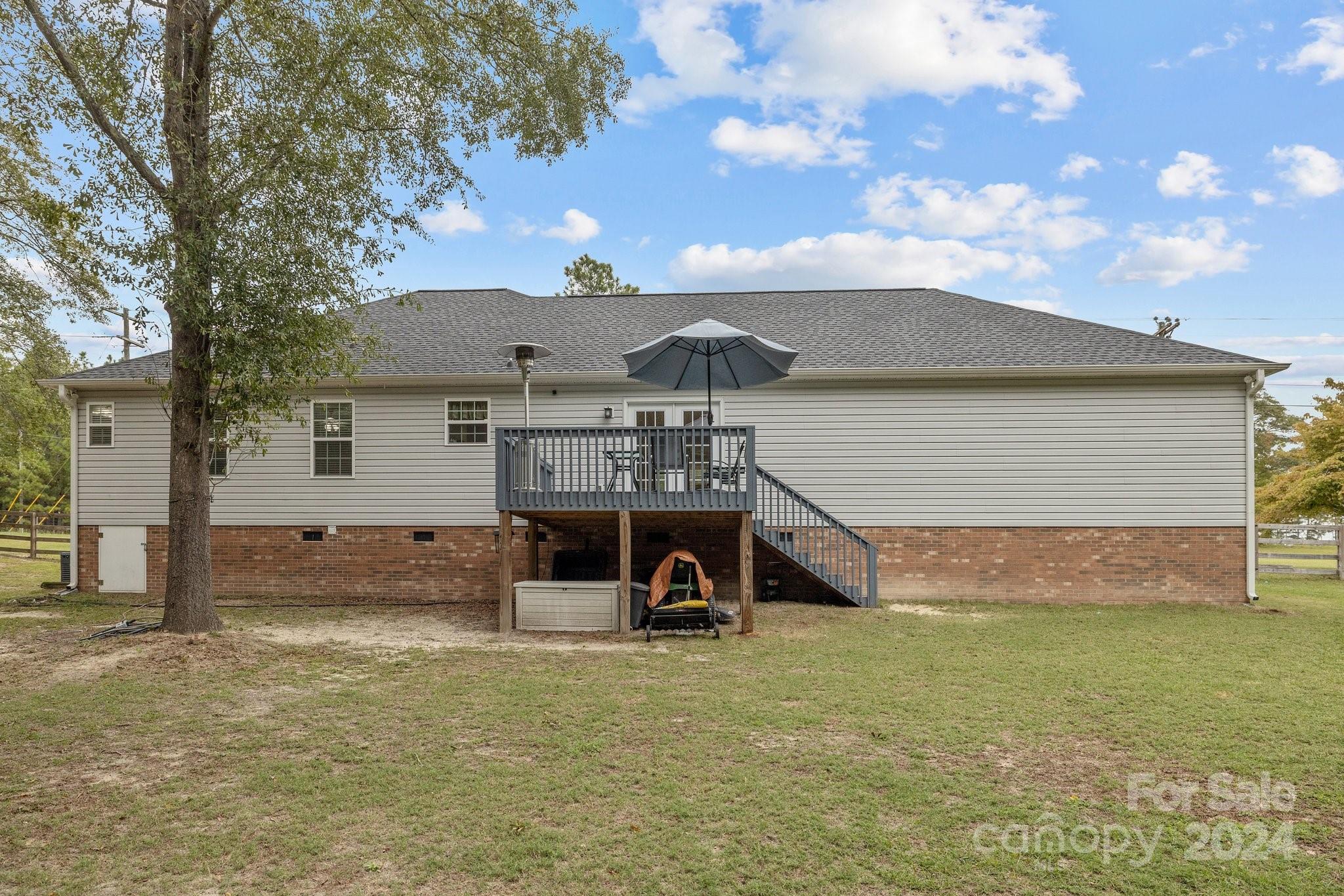 378 Boyd Faile Road Heath Springs, SC 29058 - Photo 19 of 28 a front view of a house with a yard and garage