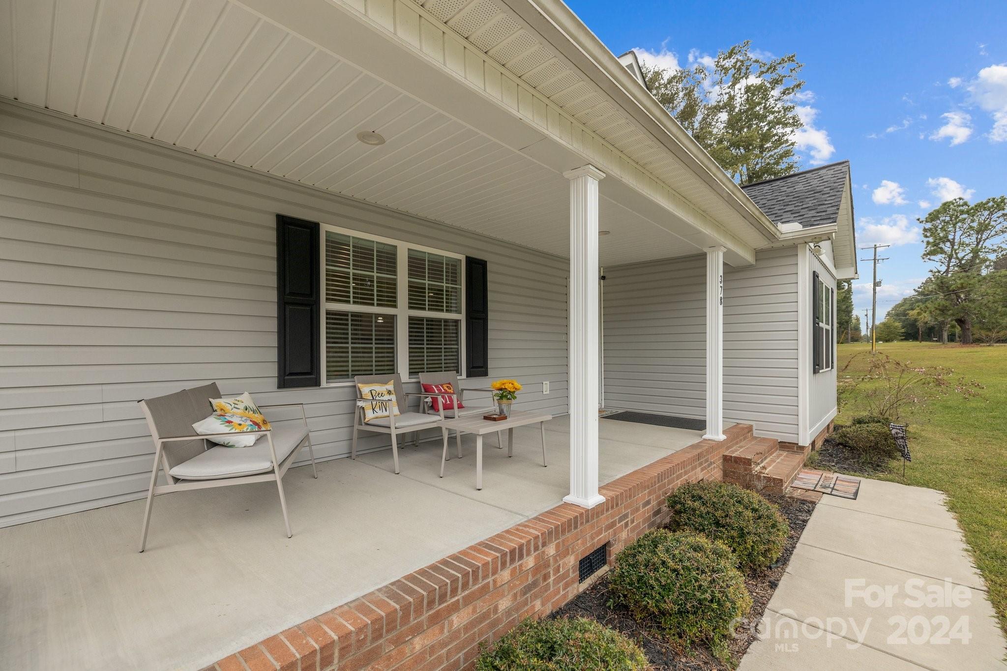 378 Boyd Faile Road Heath Springs, SC 29058 - Photo 2 of 28 a backyard of a house with outdoor seating