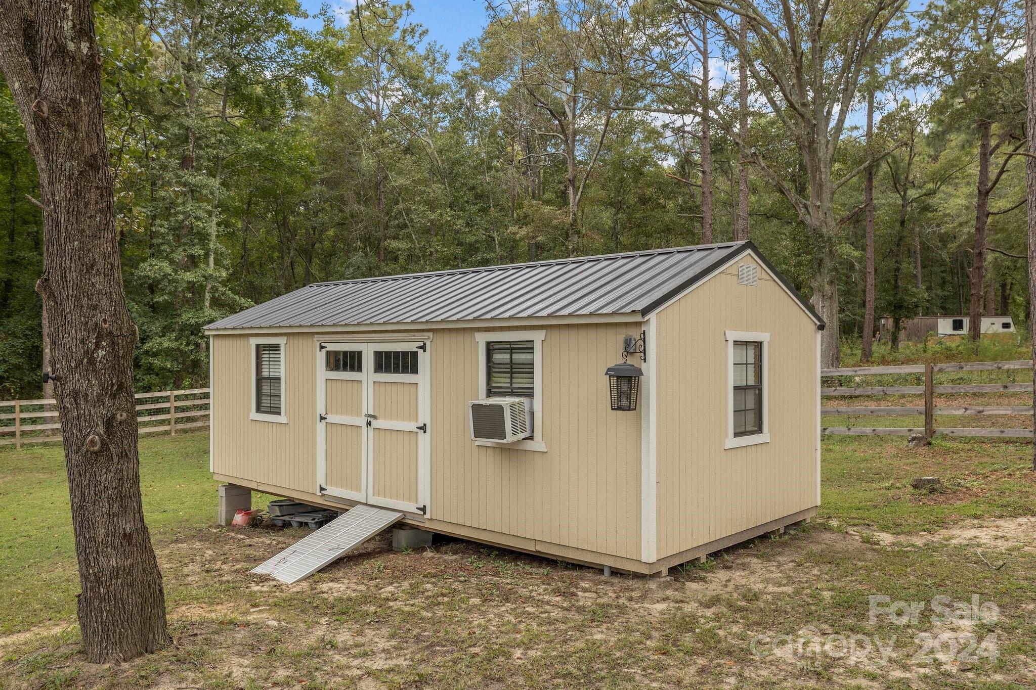 378 Boyd Faile Road Heath Springs, SC 29058 - Photo 22 of 28 a view of a house with backyard