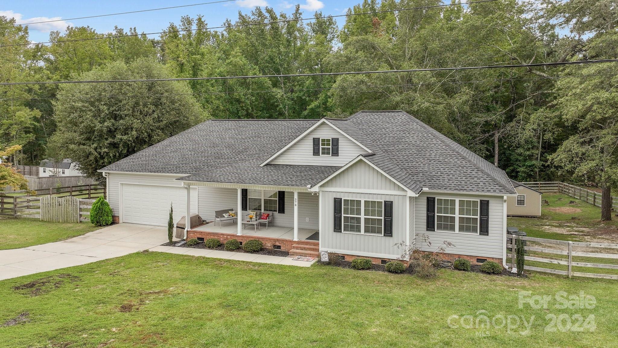 378 Boyd Faile Road Heath Springs, SC 29058 - Photo 24 of 28 a aerial view of a house with swimming pool and sitting area