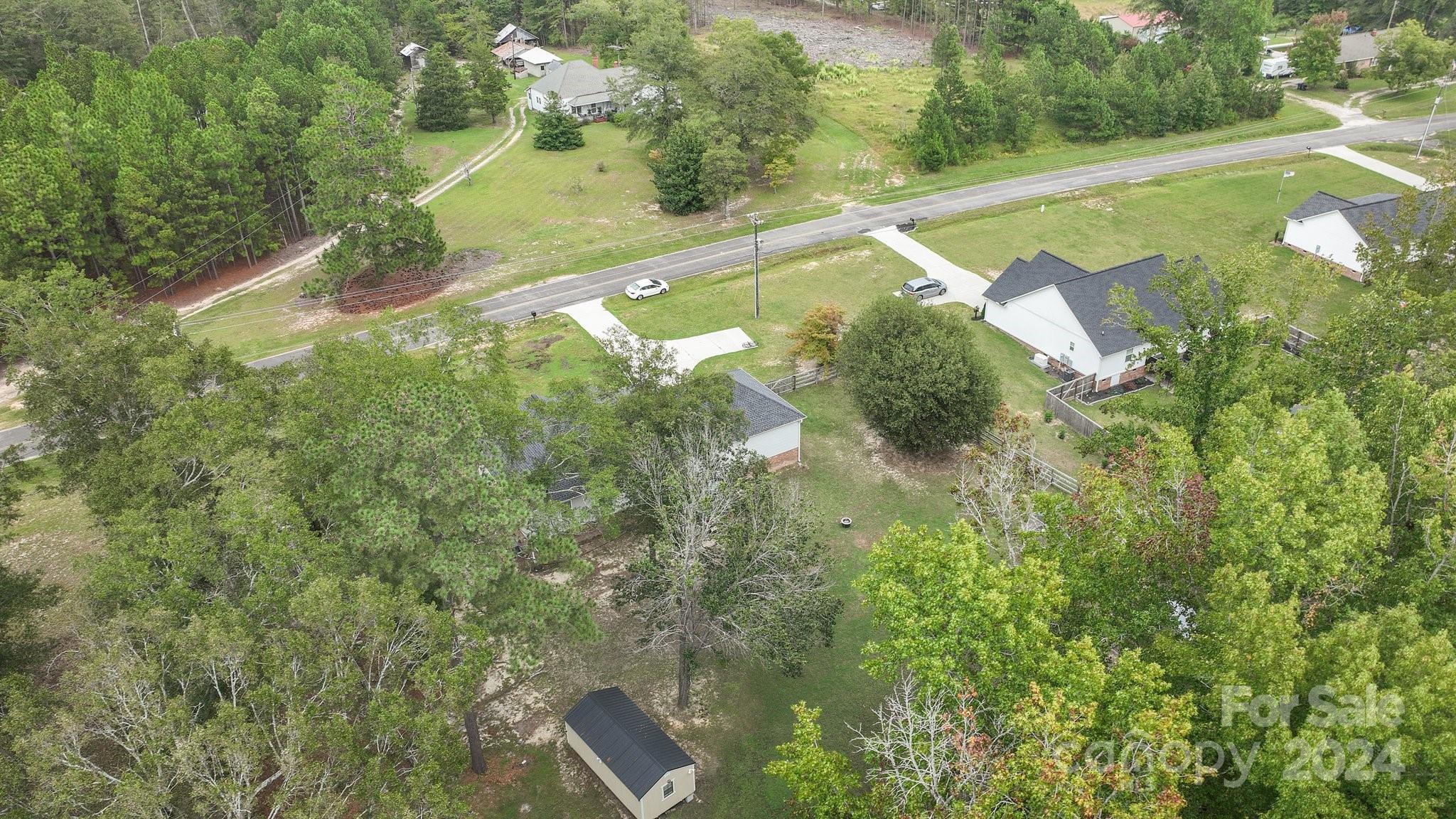 378 Boyd Faile Road Heath Springs, SC 29058 - Photo 25 of 28 a view of a yard with a swimming pool