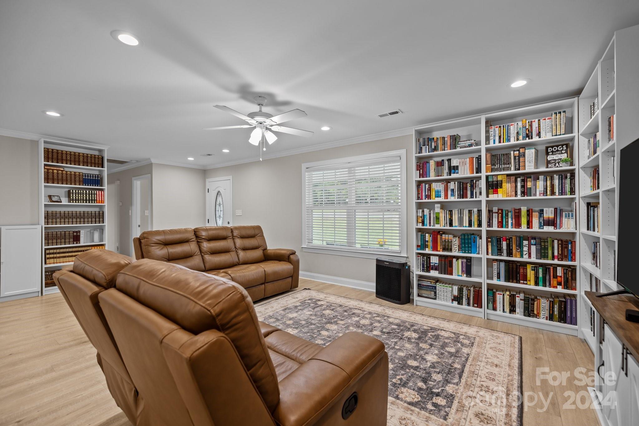 378 Boyd Faile Road Heath Springs, SC 29058 - Photo 9 of 28 a living room with furniture and a book shelf