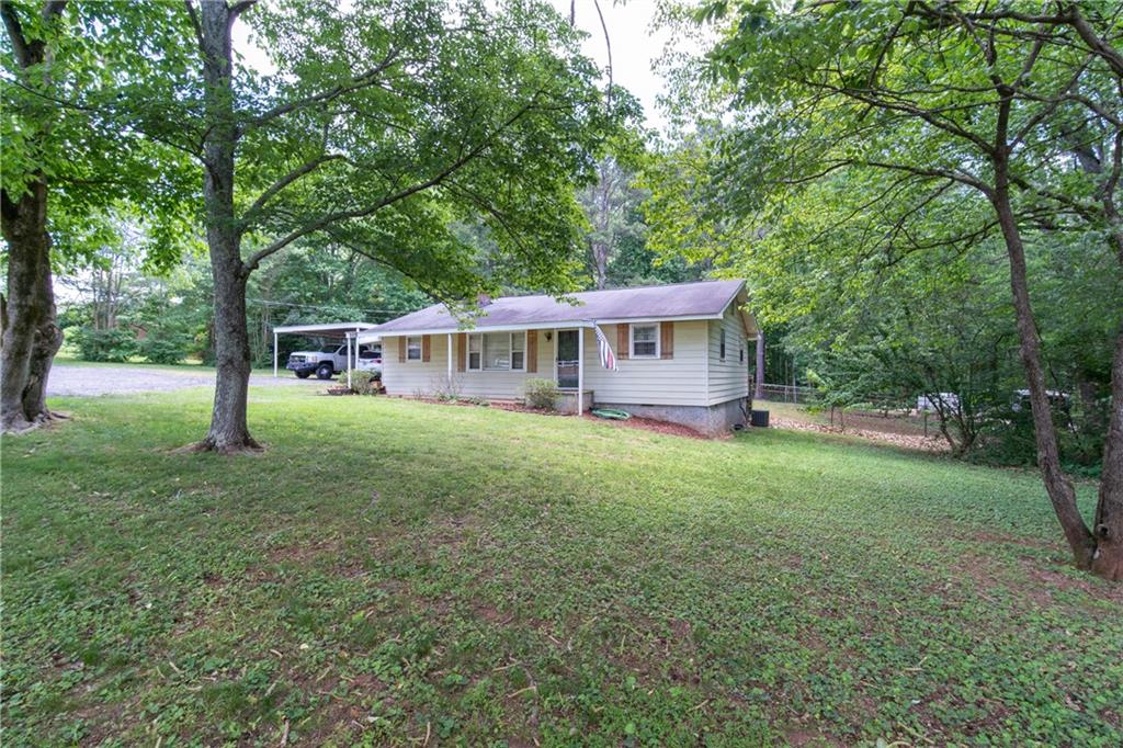 109 Paris Road Dallas, GA 30132 - Photo 1 of 1 Private front yard on a non busy street. Large mature trees offer great shade.