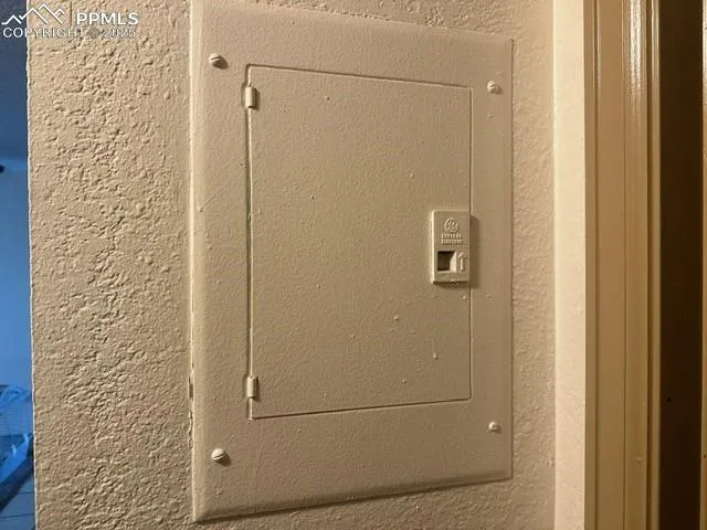 a bedroom with a bed and flat screen tv