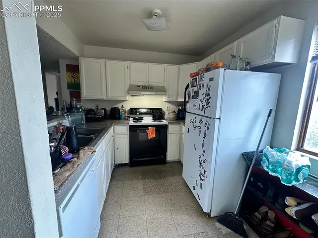 a bed room with a bed and a window