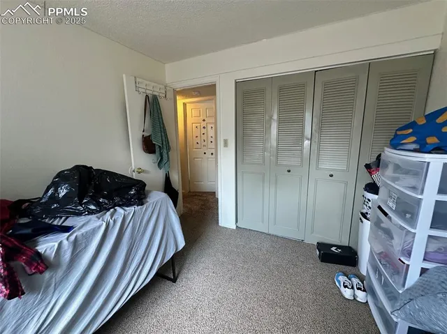 a living room with furniture and a dresser