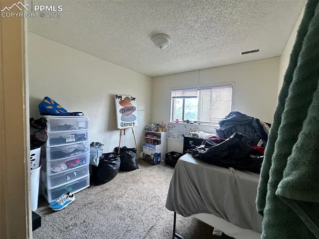 a view of a backyard with sitting area