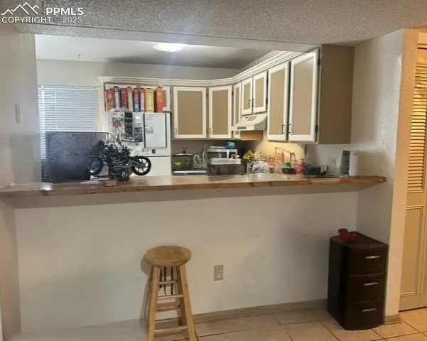 a kitchen with a sink and a window