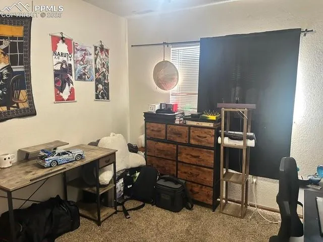 a room with a table and chairs