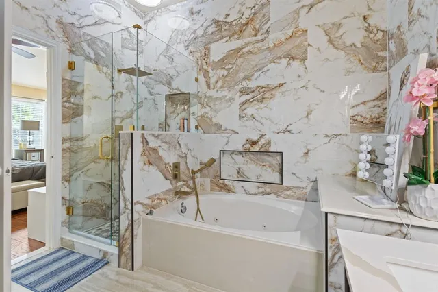 a bathroom with a bathtub and shower