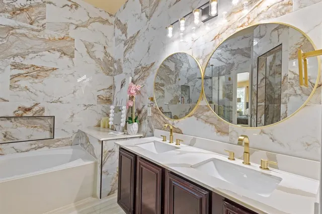 a bathroom with a sink double vanity and a mirror