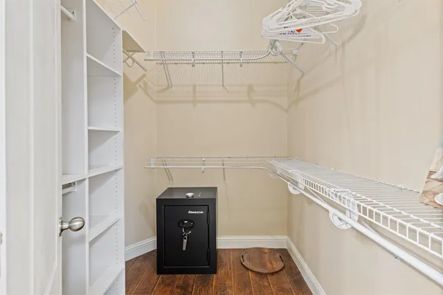 a view of a utility room with racks on the wall