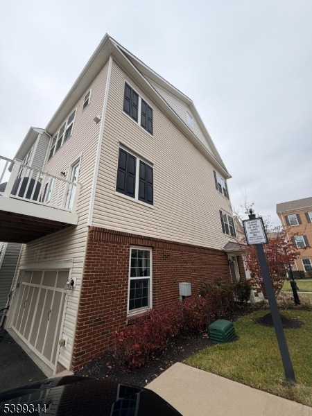 101 Truman Drive Wood-Ridge, NJ 07075 - Photo 2 of 7 a front view of a house with garden