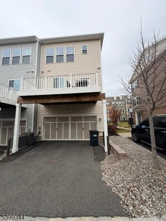 a view of a car park in front of house