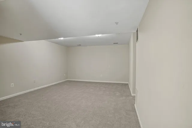 a view of staircase with white walls