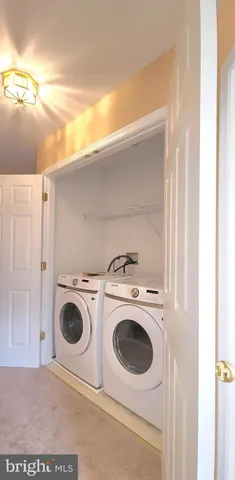 a bathroom with a double vanity sink toilet and a mirror