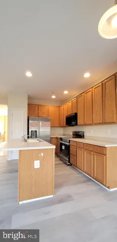a view of a kitchen with a sink