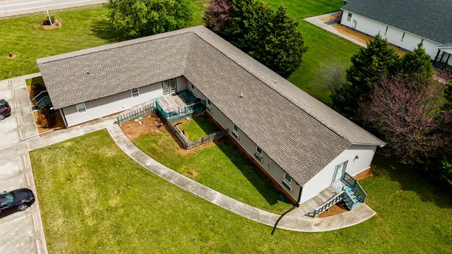 an aerial view of residential house with outdoor space and swimming pool