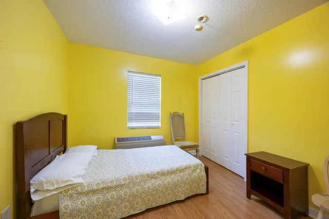 a view of workspace with wooden floor and windows