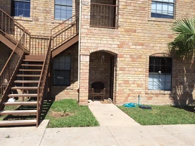 1207 Hillside Road, Unit 9 Laredo, TX 78041 - Photo 1 of 3 a front view of a house with a yard