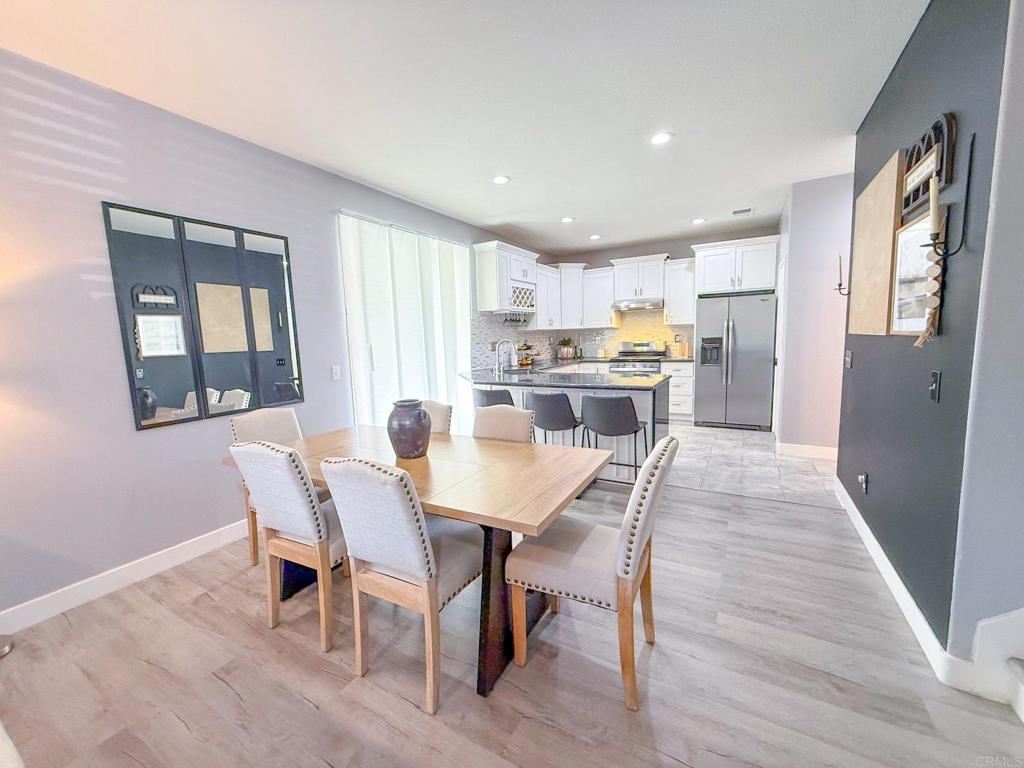3237 Warley Road Hemet, CA 92545 - Photo 11 of 43 a view of a dining room with furniture window and wooden floor