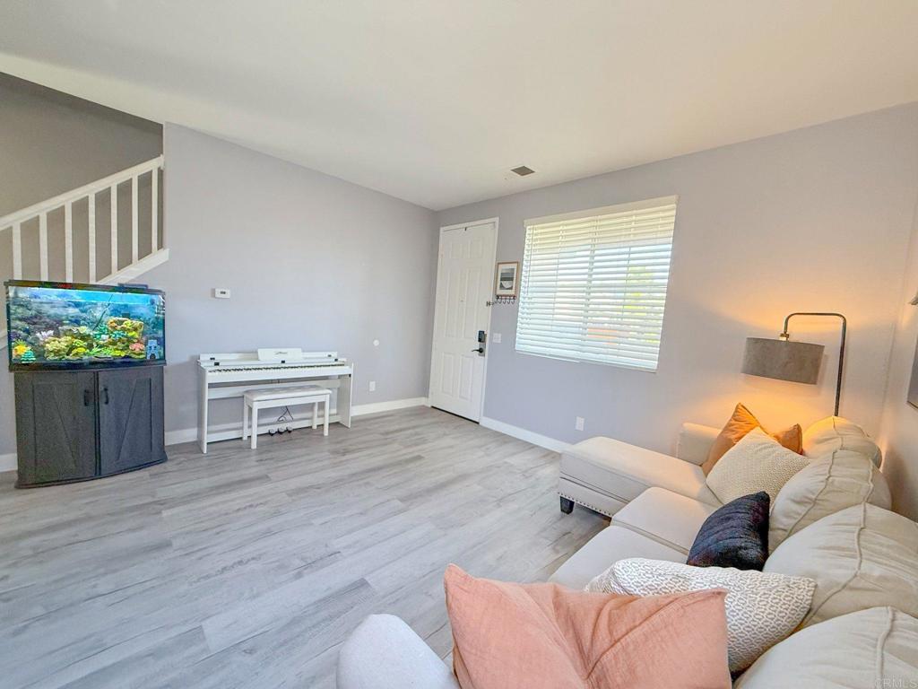 3237 Warley Road Hemet, CA 92545 - Photo 13 of 43 a living room with furniture and a wooden floor