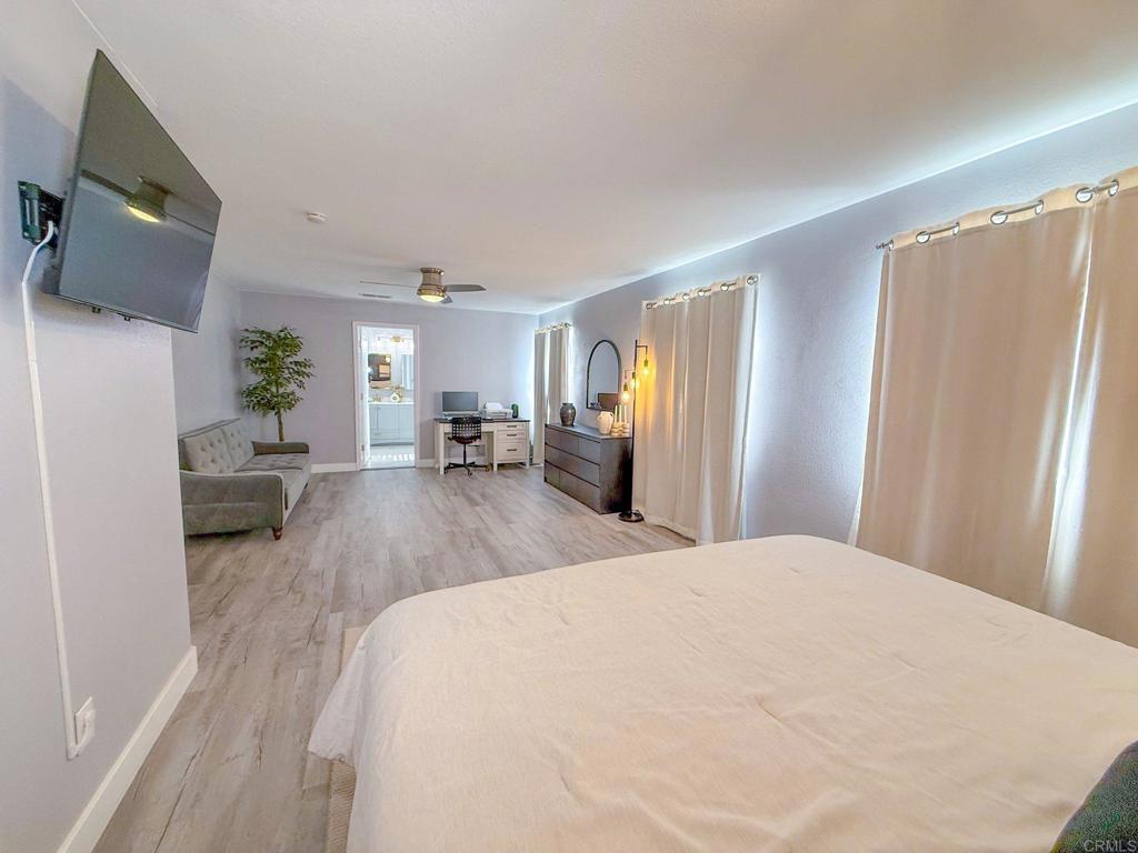 3237 Warley Road Hemet, CA 92545 - Photo 18 of 43 a bed room with a bed window and a television