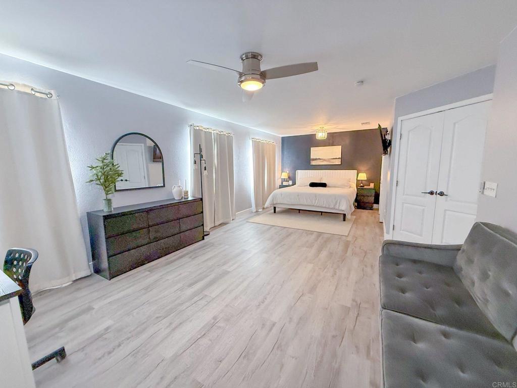 3237 Warley Road Hemet, CA 92545 - Photo 19 of 43 a living room with furniture and a wooden floor