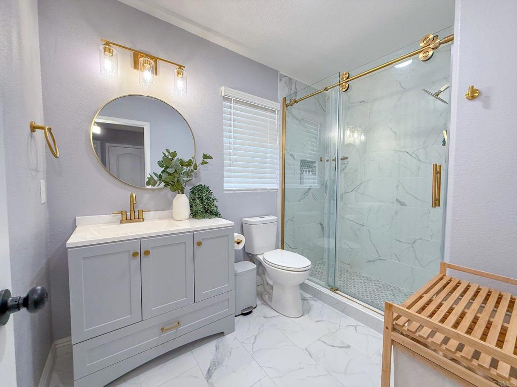 3237 Warley Road Hemet, CA 92545 - Photo 25 of 43 a bathroom with a sink and a mirror