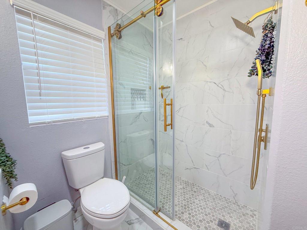 3237 Warley Road Hemet, CA 92545 - Photo 27 of 43 a white toilet sitting next to a bathroom sink