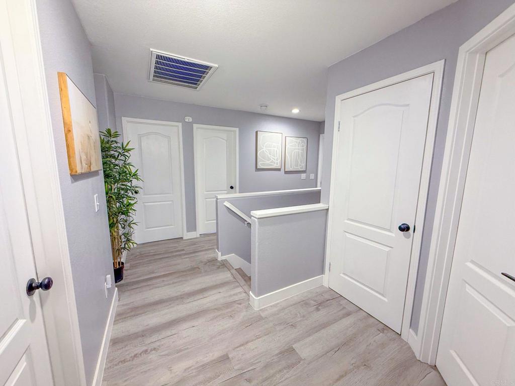 3237 Warley Road Hemet, CA 92545 - Photo 34 of 43 a view of a hallway with entryway and wooden floor