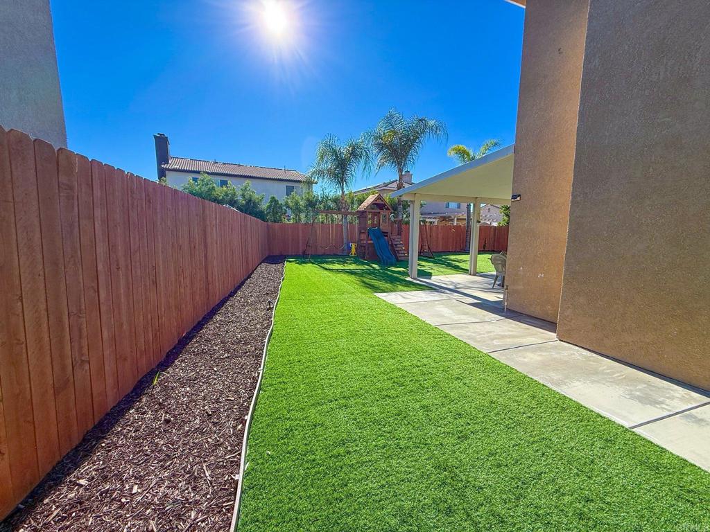 3237 Warley Road Hemet, CA 92545 - Photo 36 of 43 a view of a backyard with a garden