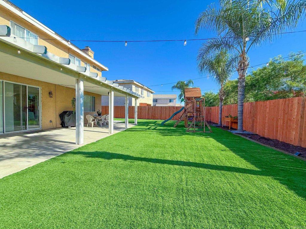3237 Warley Road Hemet, CA 92545 - Photo 39 of 43 a view of a house with a backyard porch and sitting area