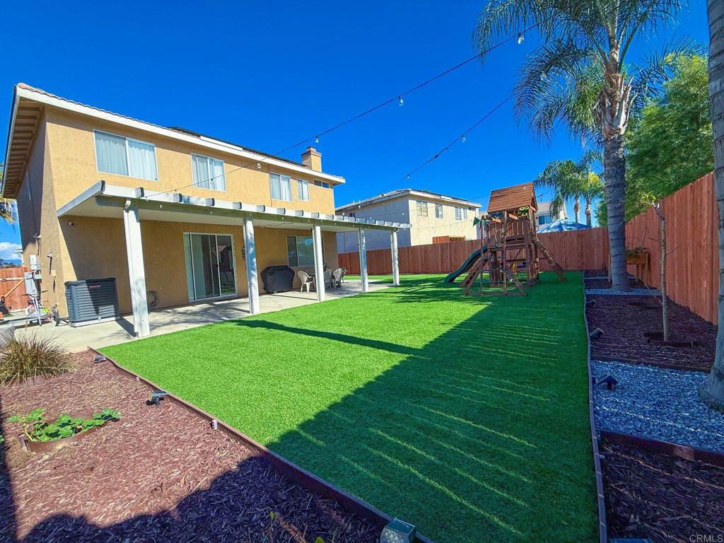 3237 Warley Road Hemet, CA 92545 - Photo 41 of 43 a view of a house with a yard