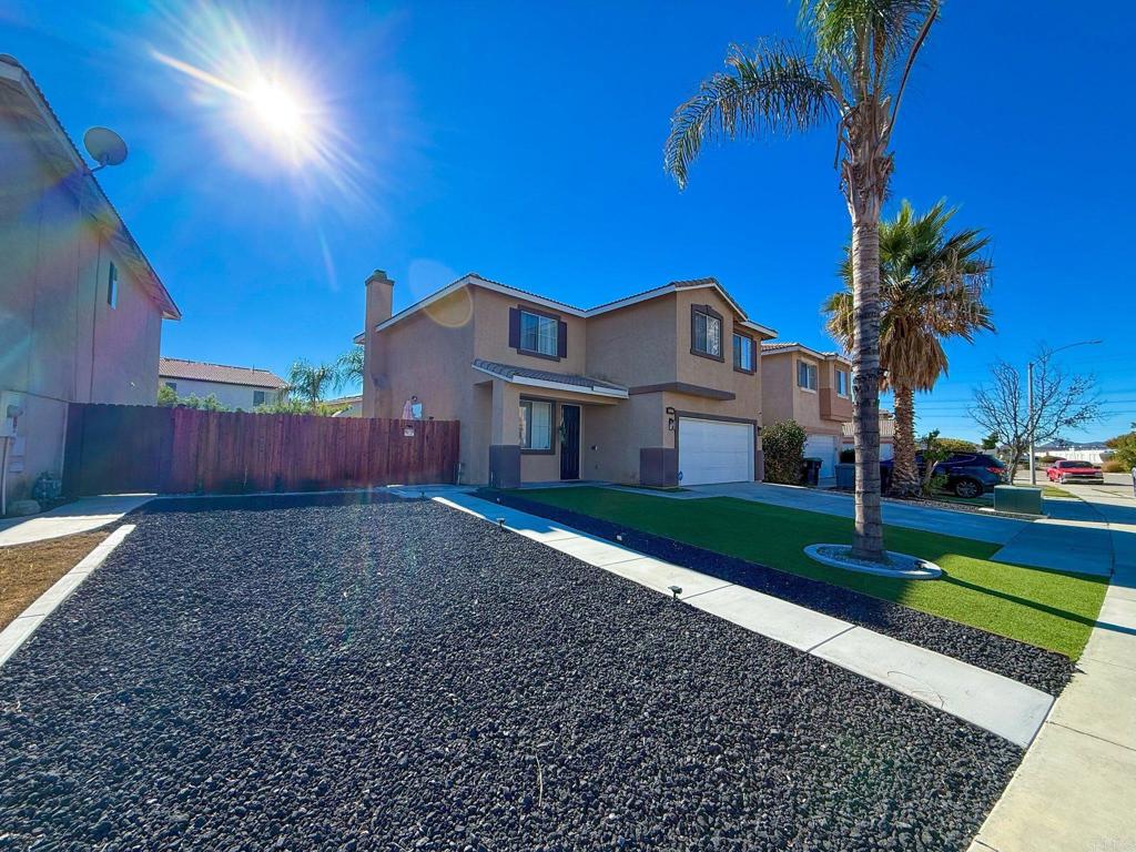 3237 Warley Road Hemet, CA 92545 - Photo 5 of 43 a front view of a house with a yard