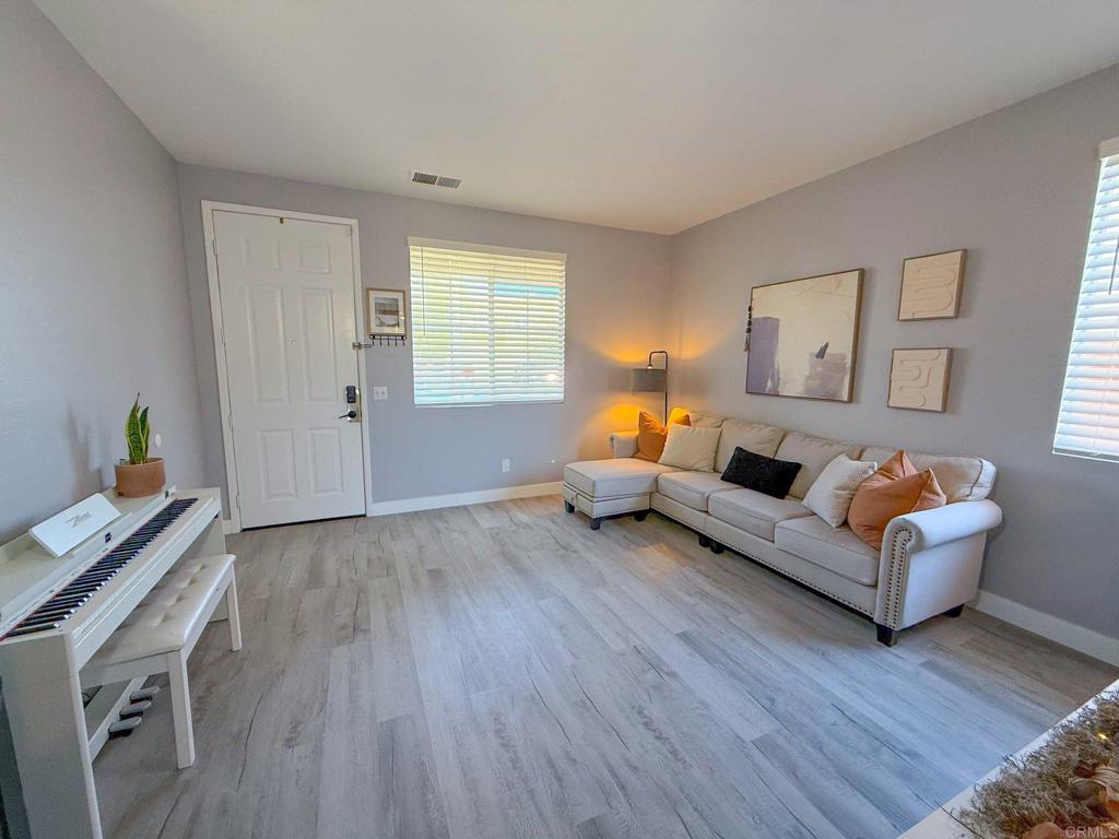 3237 Warley Road Hemet, CA 92545 - Photo 8 of 43 a living room with furniture and a wooden floor