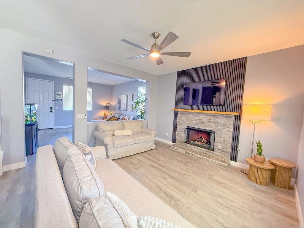 3237 Warley Road Hemet, CA 92545 - Photo 10 of 43 a bedroom with a large bed and a fireplace