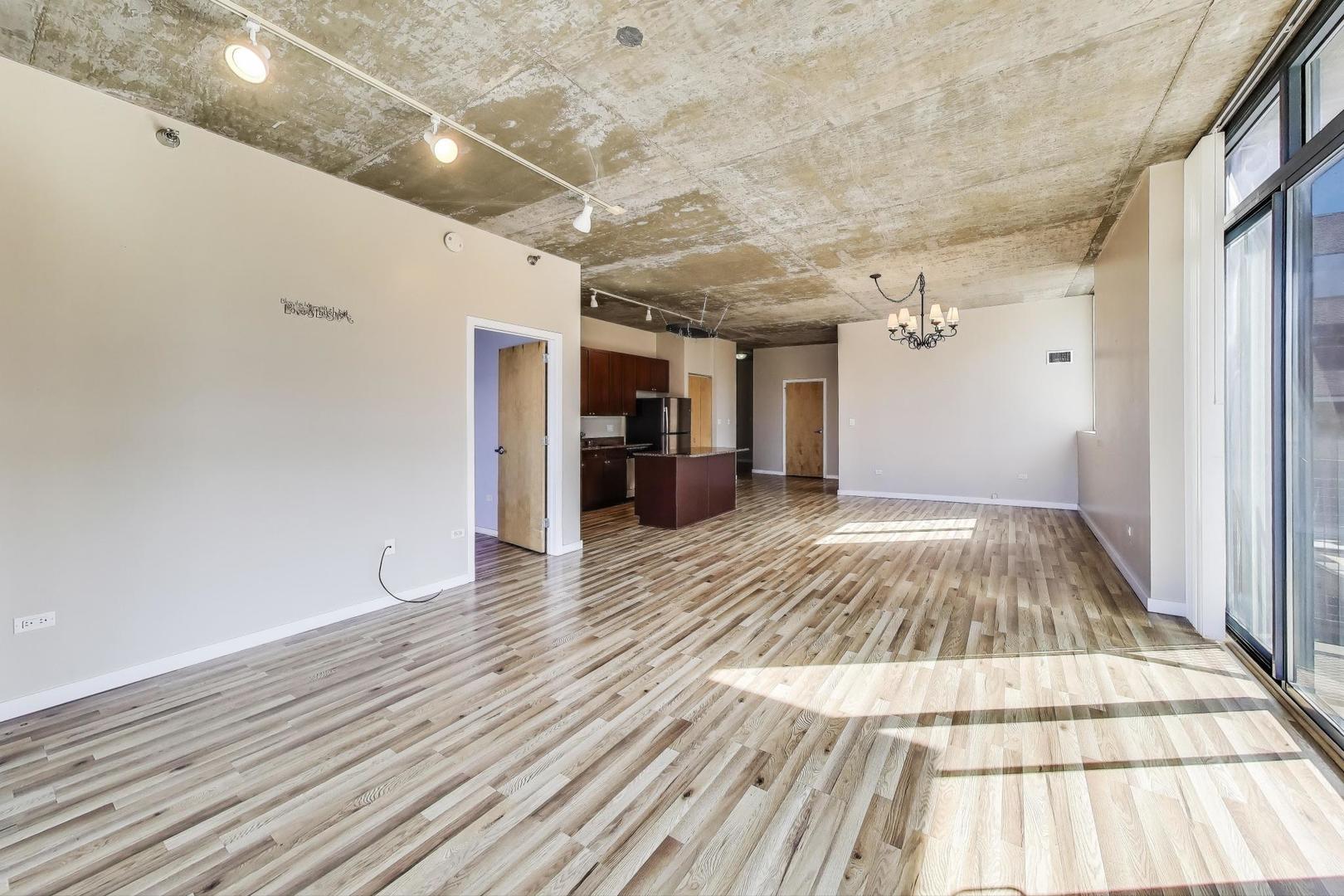 321 South Sangamon Street, Unit 605 Chicago, IL 60607 - Photo 11 of 36 a view of a room with wooden floor