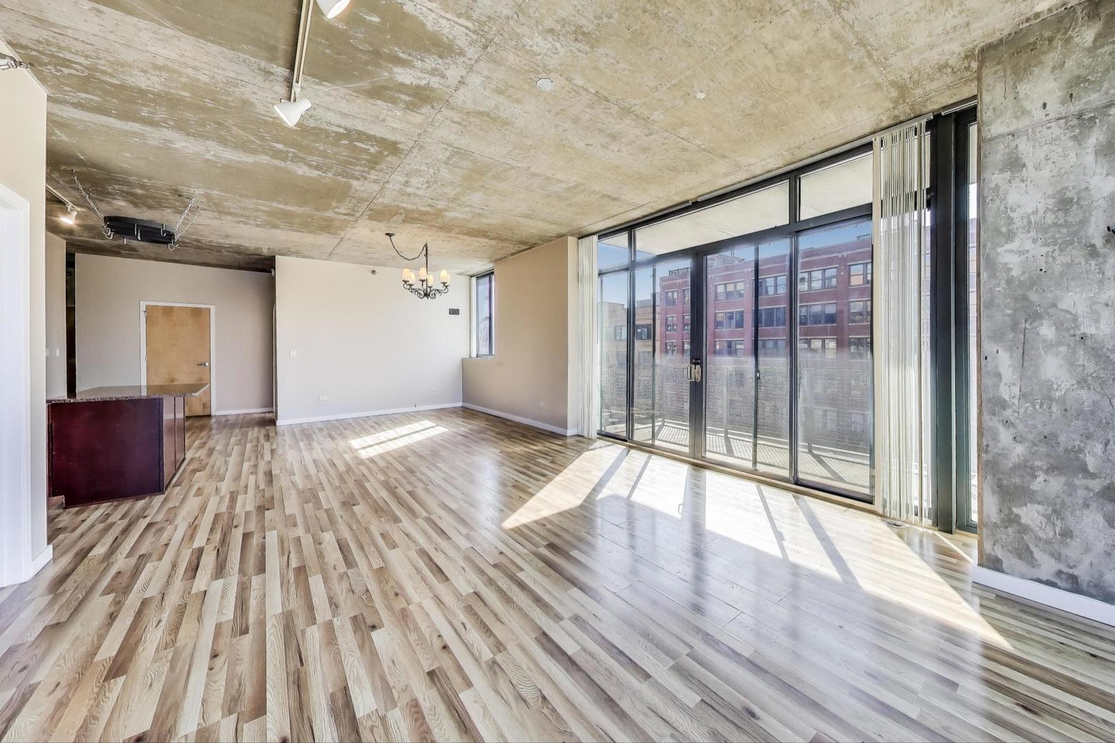 321 South Sangamon Street, Unit 605 Chicago, IL 60607 - Photo 12 of 36 a view of empty room with wooden floor and fan