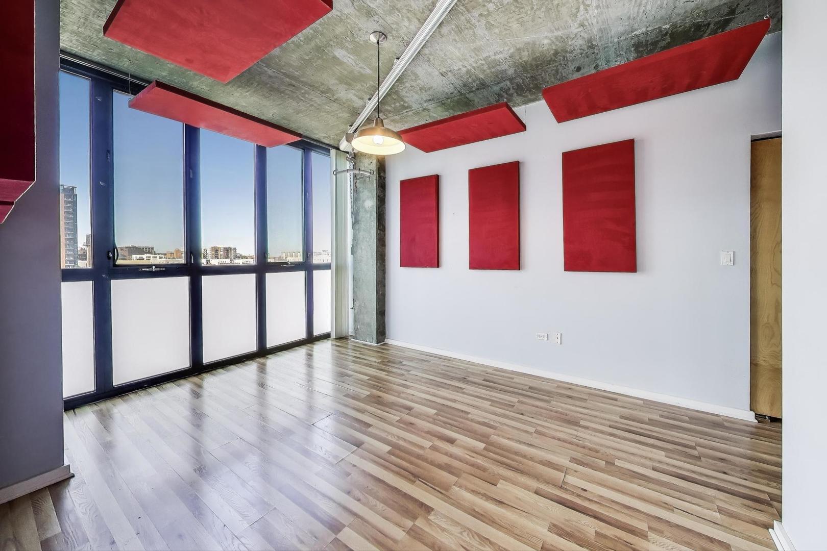 321 South Sangamon Street, Unit 605 Chicago, IL 60607 - Photo 17 of 36 a view of empty room with wooden floor and fan