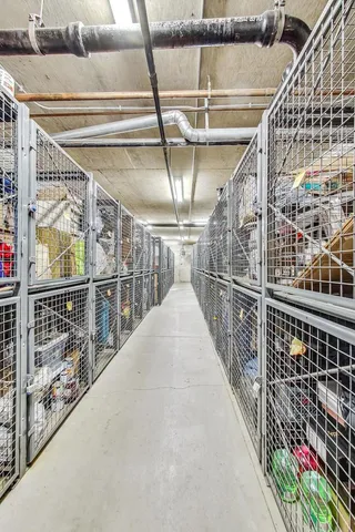 a view of parking garage with cars