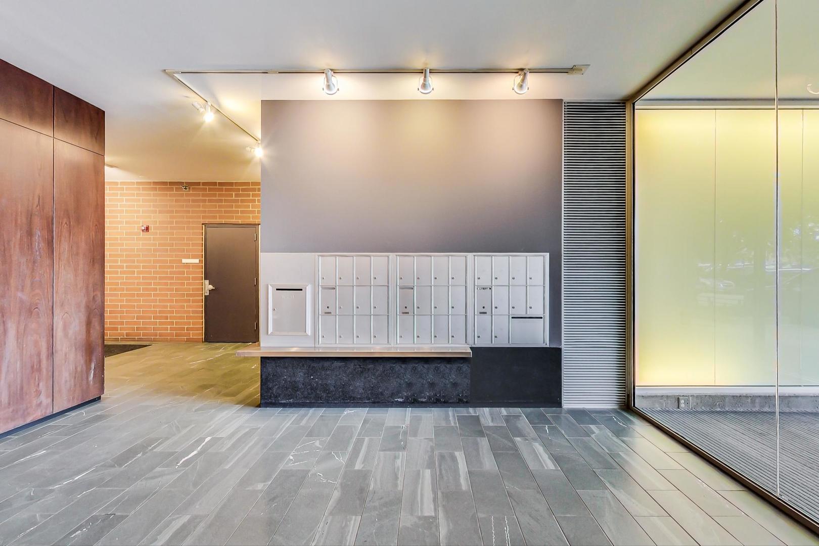 321 South Sangamon Street, Unit 605 Chicago, IL 60607 - Photo 8 of 36 a view of an empty room with wooden floor and a window