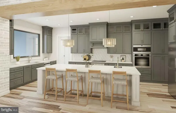 a kitchen with stainless steel appliances kitchen island granite countertop a sink and cabinets