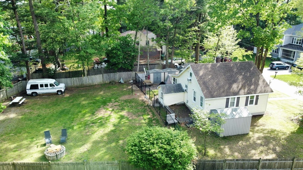 32 Birch Road Natick, MA 01760 - Photo 10 of 38 a view of a house with a yard and sitting area
