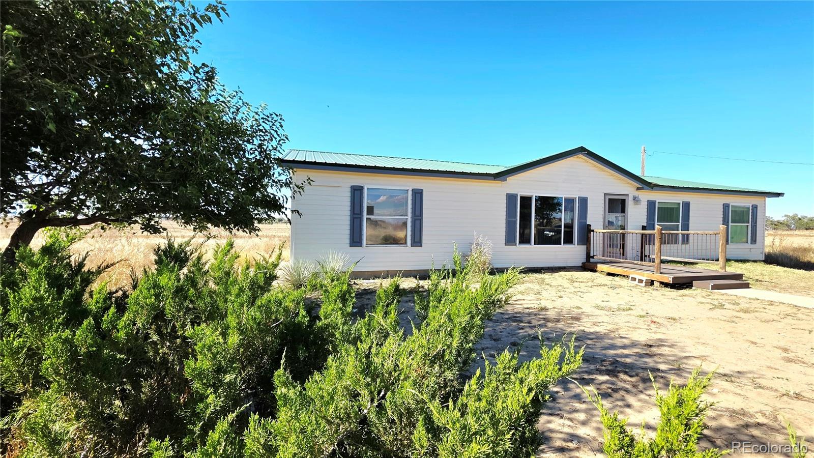 10754 County Road Olney Springs, CO 81062 - Photo 2 of 49 a view of a house with yard and sitting area