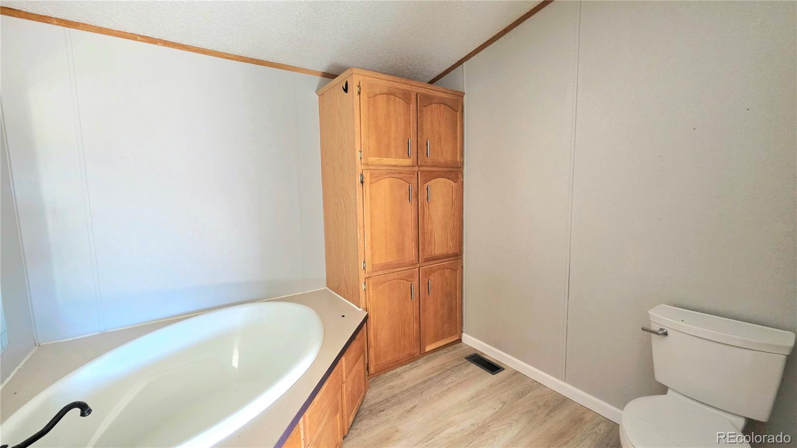 10754 County Road Olney Springs, CO 81062 - Photo 23 of 49 a bathroom with a tub and toilet