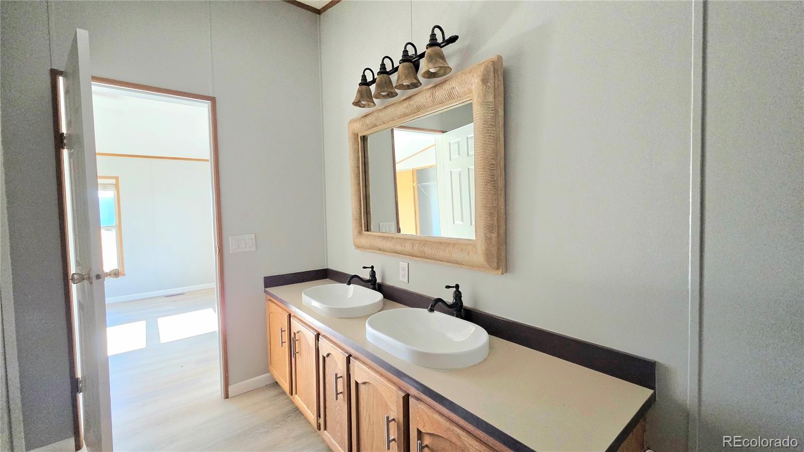 10754 County Road Olney Springs, CO 81062 - Photo 24 of 49 a bathroom with a sink and a mirror
