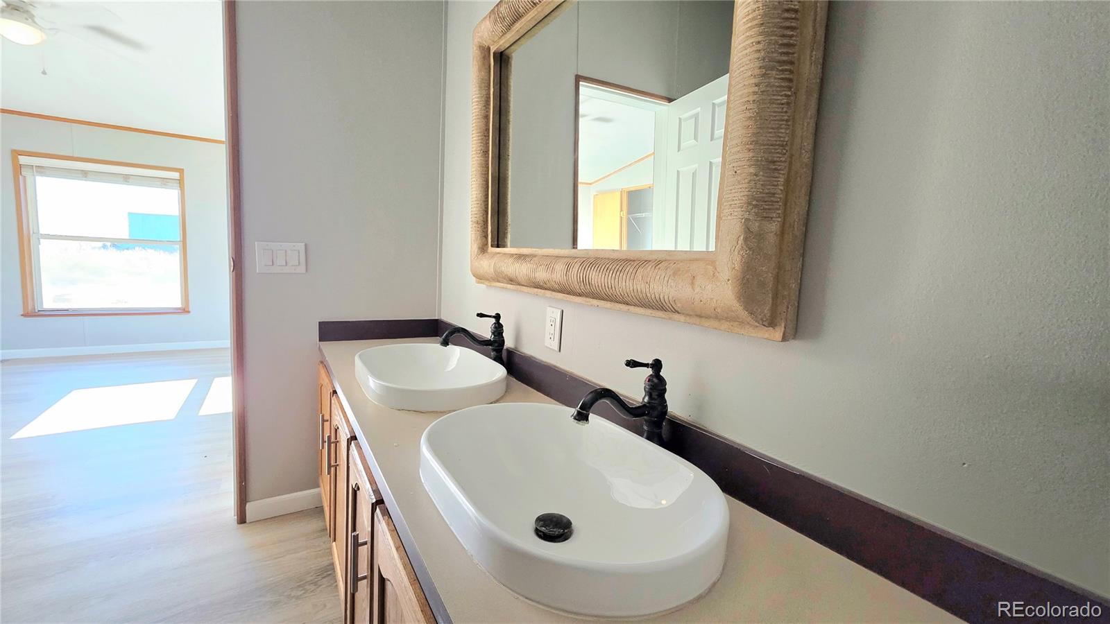 10754 County Road Olney Springs, CO 81062 - Photo 26 of 49 a bathroom with a sink and a mirror